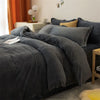 A dark gray cozy flannel duvet cover is displayed on a bed, with matching pillows and bedding.