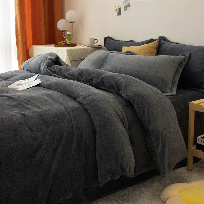 A dark gray cozy flannel duvet cover is displayed on a bed, with matching pillows and bedding.