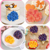 A set of 3D floral silicone molds in blue, orange, and purple for crafting candles, soap, resin, and plaster.