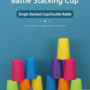 A collection of colorful plastic stacking cups in various shades are displayed on a table.