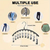 A black hanger with multiple clips is shown, designed as a pants organizer for closet use.