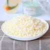 A bowl filled with white natural soy wax granules for DIY candle and skincare making.