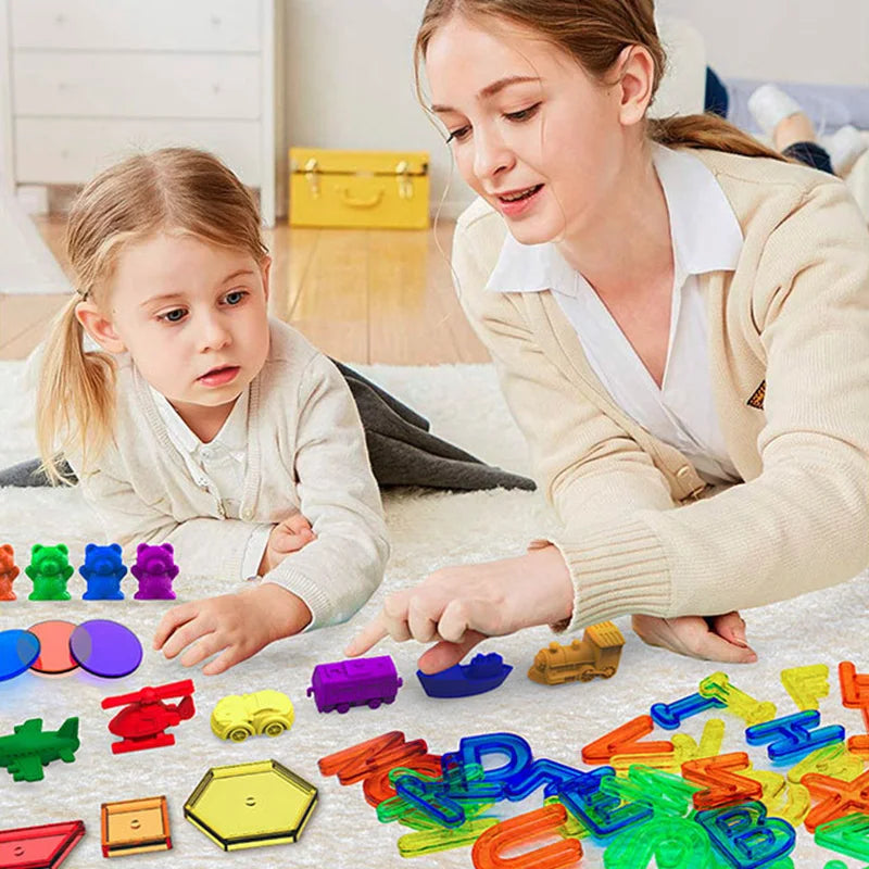 A child and an adult are playing with colorful transparent letters and numbers for sensory learning.