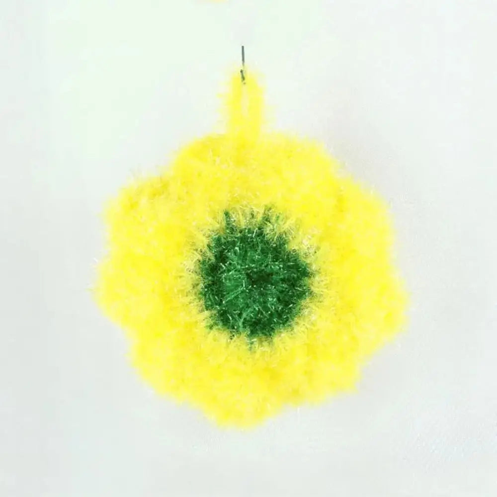 A bright yellow, fluffy acrylic non-stick dish sponge with a green center.
