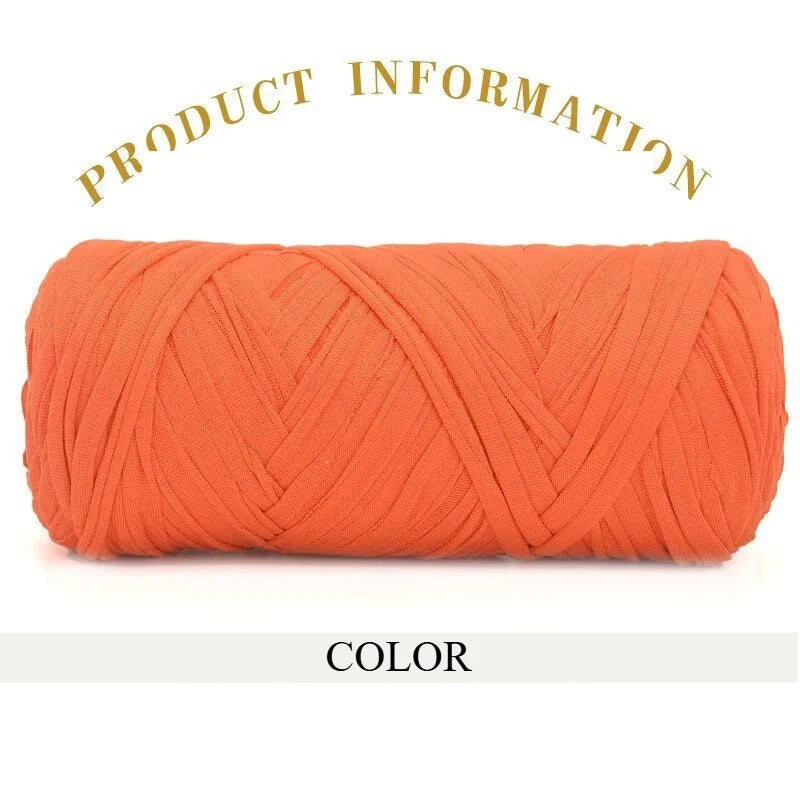 A skein of thick orange polyester blend yarn coiled for knitting and crochet projects.