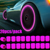 A pack of 20 luminous tire valve caps with a glow-in-the-dark design shown in various shades of pink.