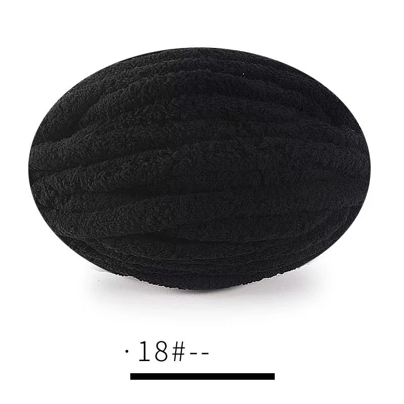 A ball of black extra thick chenille yarn for hand knitting