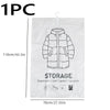 A white hanging vacuum storage bag containing a folded jacket or coat.