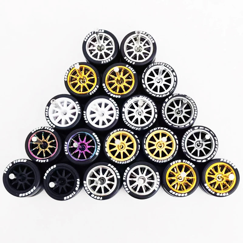 A set of ten 1:64 scale alloy car wheels and tires arranged in a pyramid formation.