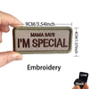 A rectangular embroidered patch with the text Mama Says I'm Special on a fabric background.