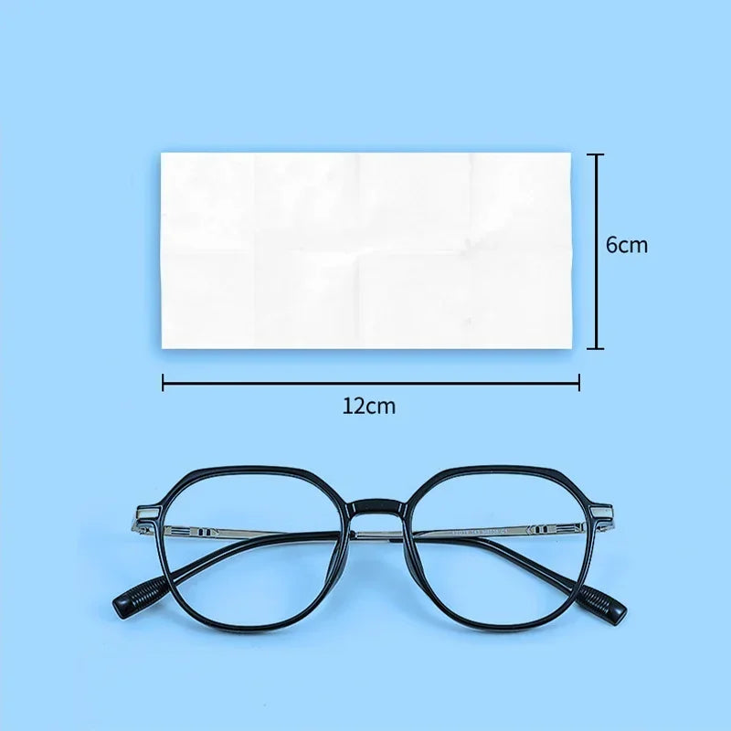 A pair of black eyeglasses is shown next to a rectangular package of lens cleaning wipes.