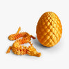 A golden articulated dragon figurine with a glowing egg, 30cm tall, shown against a white background.