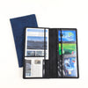 A black slim card holder wallet with a blue leather sleeve displaying various cards.