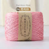 Pink bamboo fiber yarn in a skein, labeled as item 04, for knitting and crochet.
