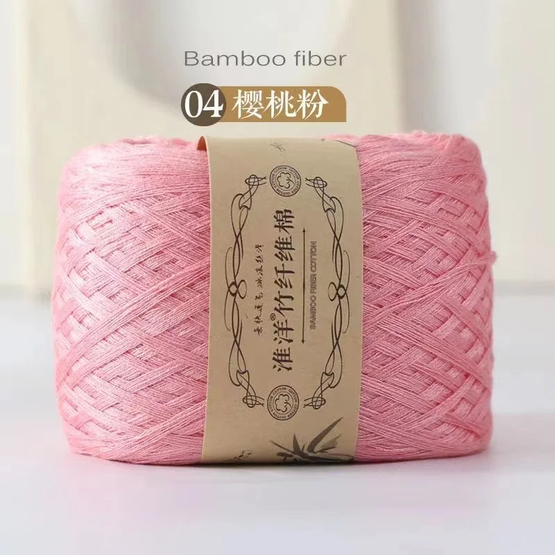 Pink bamboo fiber yarn in a skein, labeled as item 04, for knitting and crochet.