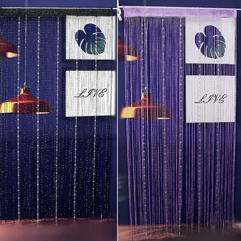 A close-up of a crystal beaded string curtain for a doorway, featuring purple and blue strands with decorative panels.