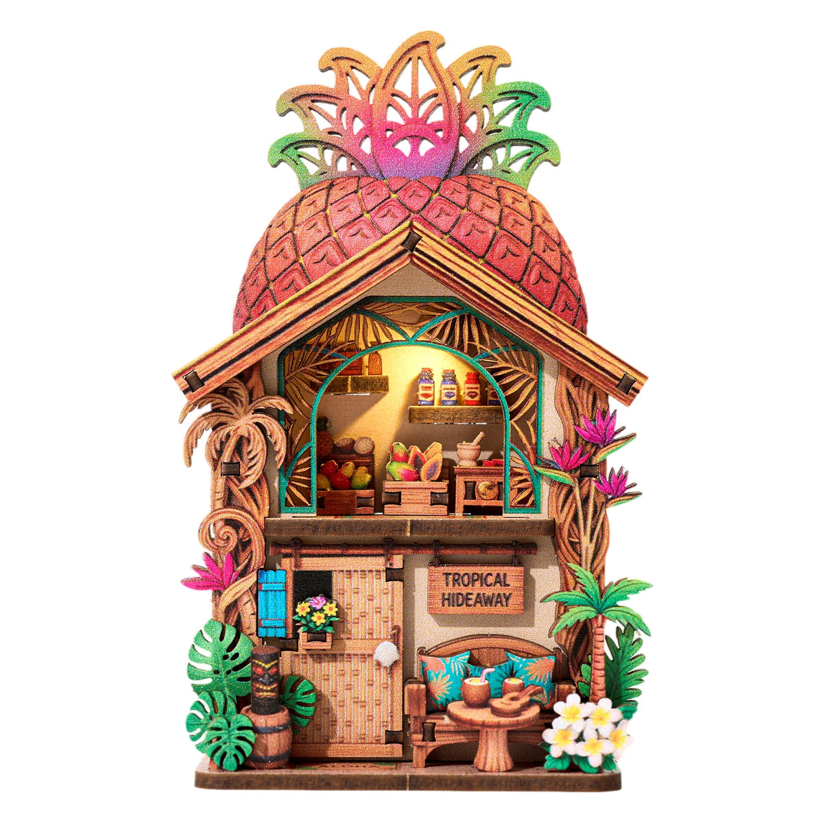 A DIY book nook kit featuring a tropical hideaway scene with LED lighting and decorative elements.