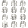 A set of twelve decorative metal napkin rings with a hollow-out pattern.