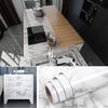 Roll of white marble peel-and-stick film for kitchen backsplash