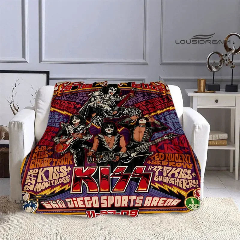 A flannel throw blanket featuring a graphic design of the Kiss band and text related to Diego Sports Arena.