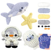A set of crochet animals including a gray shark, yellow starfish, and white and gray stuffed creatures.