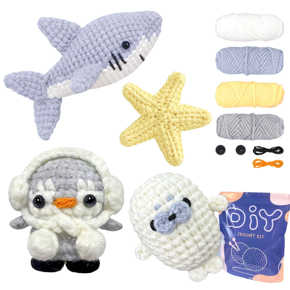 A set of crochet animals including a gray shark, yellow starfish, and white and gray stuffed creatures.