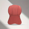 A pink memory foam lumbar support and neck pillow set with quilted texture.