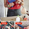 A person is using a hot melt glue gun to apply glue to pine cones and floral arrangements.