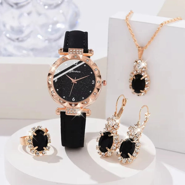 A gold-toned quartz watch with a black leather band and rhinestone accents displayed on a white surface.