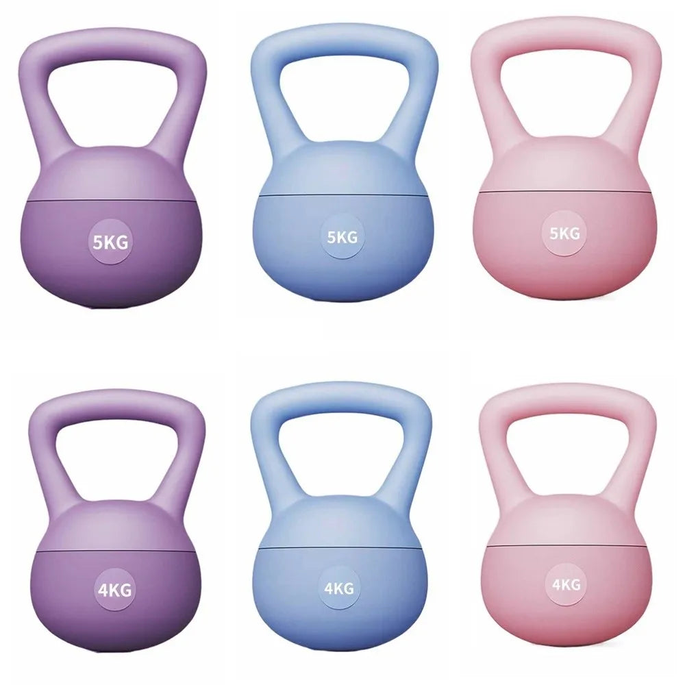 A set of five soft kettlebells in purple, blue, and pink colors, each marked with a weight.