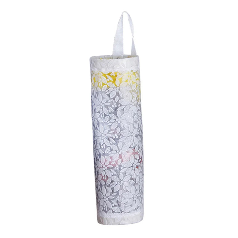 Wall-mounted plastic bag dispenser organizer with a white and gray floral pattern.