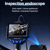 A hand holds a black industrial inspection endoscope with a 4.3-inch screen, inspecting a coiled pipe.