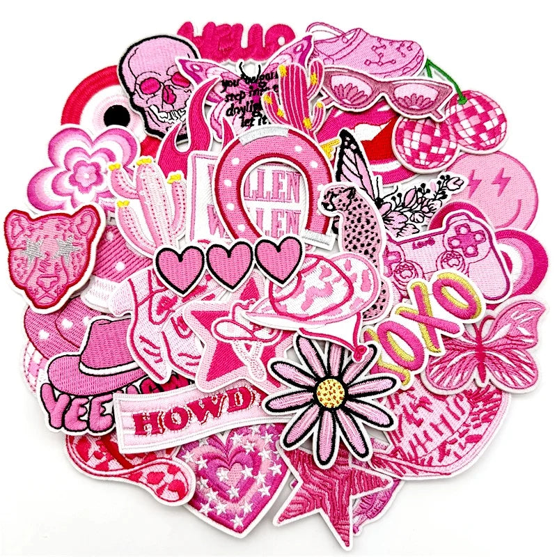 Assorted pink embroidered iron-on patches featuring various floral and decorative designs