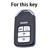 A black and silver TPU protective key case for a vehicle key.
