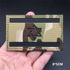 A rectangular tactical patch featuring a camouflage pattern with a central Star of David symbol on a khaki background.