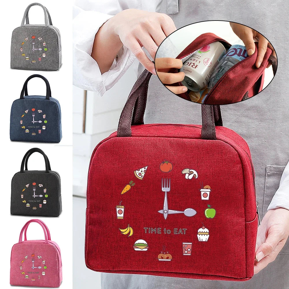 A red insulated lunch bag featuring various food icons and a fork, shown being held by a person.