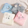 Three soft hooded baby bathrobes featuring cartoon animals: a blue elephant, a gray elephant, and a pink cat.