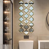 Moroccan-inspired decorative mirror wall stickers featuring a vertical, diamond-shaped pattern on a beige wall.