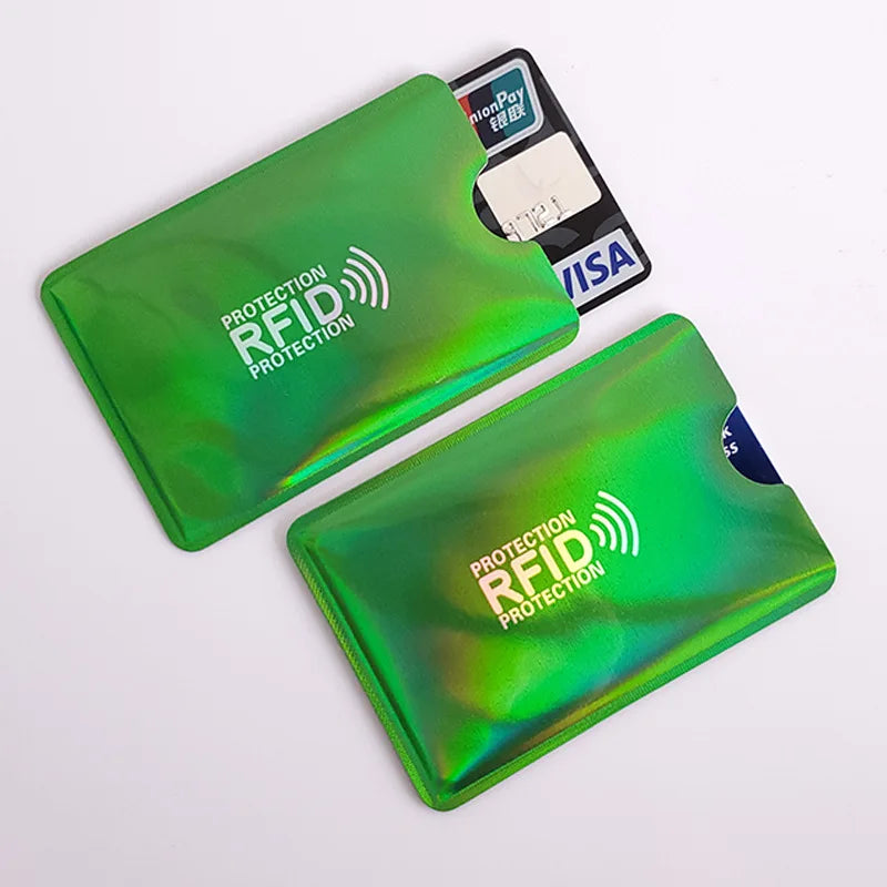 A green RFID protection card sleeve with a black credit card visible inside.