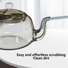 A clear glass teapot with a silicone straw cleaning brush attached, demonstrating easy and effortless dirt scrubbing.