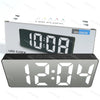 A rectangular LED clock display showing 10:08 PM on a white box.