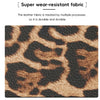 A close-up of a brown and black leopard print leather fabric used for a durable wallet.