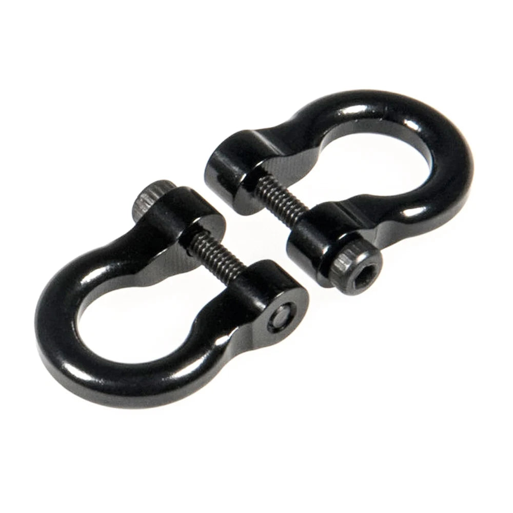 A pair of black metal alloy tow shackles for an RC crawler, packaged as a 2-pack.