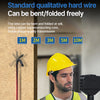 A man in a safety vest is holding an industrial endoscope probe against a wall, demonstrating the flexible wire cable.