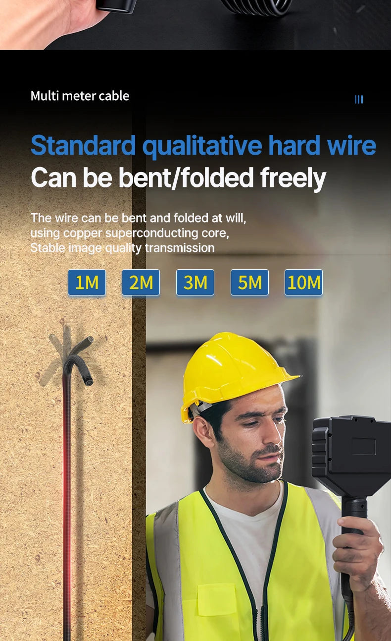 A man in a safety vest is holding an industrial endoscope probe against a wall, demonstrating the flexible wire cable.
