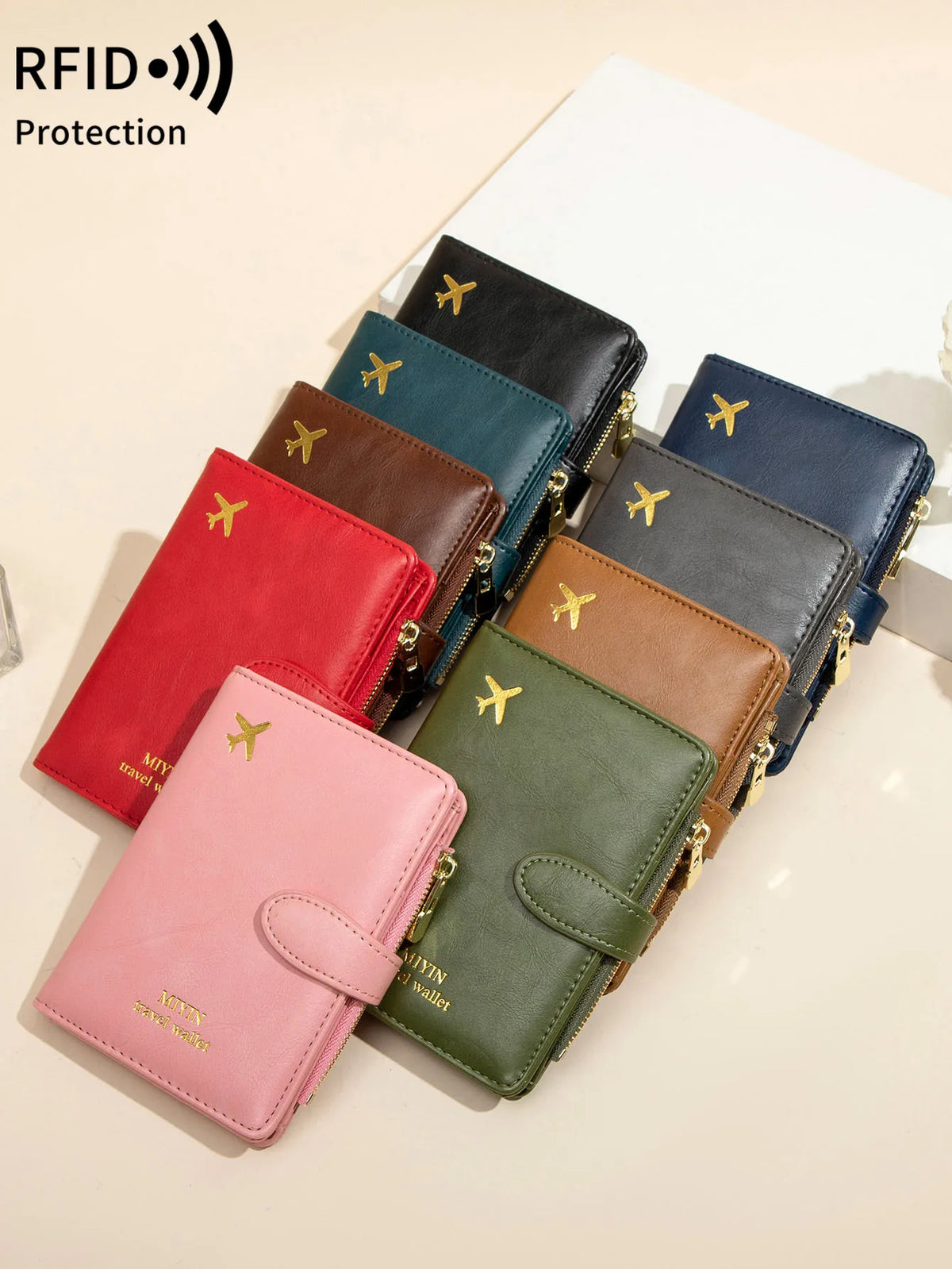 A stack of leather RFID-blocking passport wallets in various colors, including red, green, brown, and navy blue.