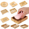 A collection of natural bamboo soap dishes and holders for various soaps and products.