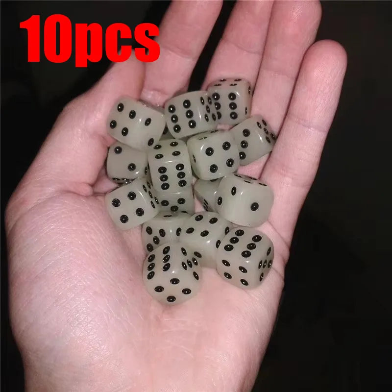 A hand holds a set of 10 glow-in-the-dark acrylic dice for night games.
