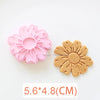 A set of three pink and orange floral cookie cutters featuring cherry blossom, peach blossom, and sunflower designs.