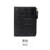 Black women's minimalist croc-embossed PU leather bi-fold wallet.